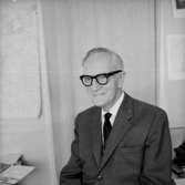 En man, bröstbild.
Olle Johansson AB, personalen.