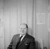 En man, bröstbild.GetzmanBilden tagen för pass.