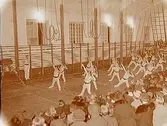 Arbetarnas gymnastikförening (AGF), gruppbild, gymnastikuppvisning.