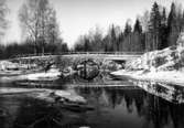 Rastälven vid Nyhyttan, bron över älven.
Vinterbild.