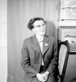 Rumsinteriör, en kvinna.Beijer