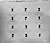 Omslagspapper med mönster.
Oscaria Skofabrik.