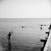 Badplats, fem personer.