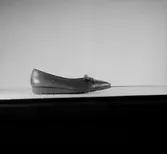 En sko.
Oscaria Skofabrik.