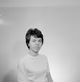 En kvinna, bröstbild.
Örebro Sparbank.