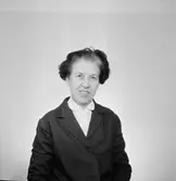 En kvinna, bröstbild.
Örebro Sparbank.