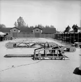 Vretstorpsverken, transportband.
Fabriksbyggnader i bakgrunden.