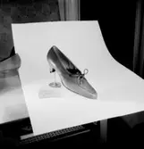 En sko.
Oscaria Skofabrik.