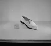 En sko.
Oscaria Skofabrik.