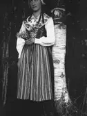 En kvinna i folkdräkt.
Dalarna
