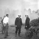 Pyromanbränderna i Kopparberg den 19 juni 1961. Brandsläckning.
Brandmannen till höger heter Renholtson.