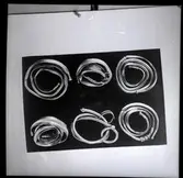 Sex stycken guldringar från Skedemosse 20/3 1960.
6 ormhuvudringar, mossfynd,  från romersk järnålder - folkvandringstid, funna av Ulf Erik Hagberg 1960.