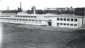 AB Kalmar nya tapetfabrik vid Södra vägen 1939 .
Observera gasklockan i bakgrunden.