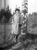 Kvinna. Tidsomfånget är 1900 - 1940