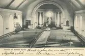 Vykort föreställande interiör av Madesjö kyrka.