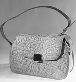 AXEL LIDHOLMS EKIPERING

Damväska

17 februari 1949

