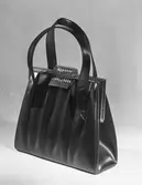 AXEL LIDHOLMS EKIPERING

Damväska

17 februari 1949

