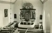 Interiör mot altaret i Ås kyrka.