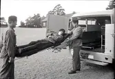 Orig. text: 7 okt. Bussavdelningen. Ambulansbil tagen vid T.1. Verkstäderna.