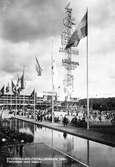 Stockholmsutställningen 1930. Festplatsen med masten. Reklam för bland annat Läkerol



