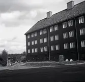 Arbetarkasern i inpanelat korsvirke.