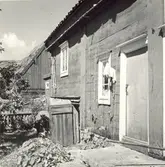 Byggnad uppförd i liggtimmer i Folkeslunda.