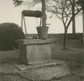 En hink på en brunn. Malmen, Ture Bosins.