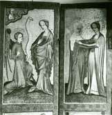 Helgonskåp från 1400-talet i Högby kyrka; målningar på över hälften av vänstra dörren:
Bebådelsen samt Marias och Elisabeths möte.