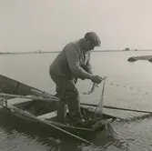 Fiskare i arbete utanför Gunnarstorp.