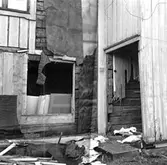 Skara.
Kvarteret Jupiter nr. 11.
Bostadsfastigheten vid gatan, norra fasaden när brädfodringen börjat avlägsnas.