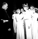 Skara. 
Skaraborgs Lucia 1965, Ewa Hornvall, kröning med biskop Sven Danell.