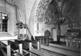 Götene sn. 
Kyrkan, Långhuset och koret från sydväst.

Fototid: 18/11 1963.