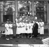 Real i Borgarskolan och Handelsskolan.
Avgångsklasserna i Flickskolan. 1941