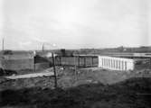 BRO. Kävlingebro. Lund, mars 1925. Lund C. Viaduktbygge till Decan villetåg. Skylt  Svenska Lantmännens.