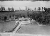 Flygfoto över Hökhults Gård  i Värnamo kommun. Nr. H. 1890.