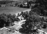 Flygfoto över Lunboholm i Värnamo kommun. Nr H 1864