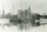 Exteriör. Huvudkontoret under uppförande 1898, Gustavsbergs Hamn och Farstaviken.