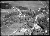 Flygfoto över Kumla kyrka, Kumla kyrkby.