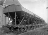 Statens Järnvägar, SJ självlossande kolvagn Q17 23008

Dessa kolvagnar hade fördelen med cylindriska luckor, detta innebar 
reglerbar lossning av kollasten.