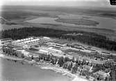 Flygfoto över verkstaden
Envånings stationshus i trä  Hållplats öppnad 1.12.1911. Även lastplats 1.5.1912