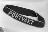 Uniformsdetalj för portvakt.