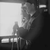 Statens Järnvägar, SJ Tåghem, resenärer i fönster.