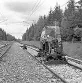 Spårrevision. Räls och slipersbyte (betongslipers). Linjen Rotebro, R - Zlpv. Spårriktare