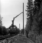 Elektrifieringsarbete på linjen mellan Rättvik och Mora, stolpresning.