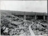Porjus kraftverk under byggnation vid Stora Lule älv. En del av den stora dammen.