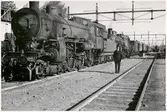 Ånglok på bangård. Ort okänd.