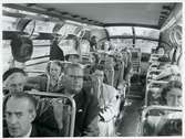 Passagerare i buss.