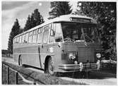 Norskregistrerad Scania turistbuss med teatergolv fotograferad i Osloområdet.