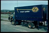 Scania lastbil märkt ASG transport-spedition.