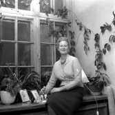 En kvinna.
8 november 1958.